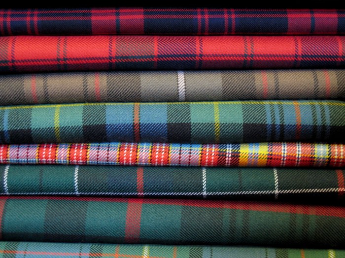 folded bolts of different tartan fabrics