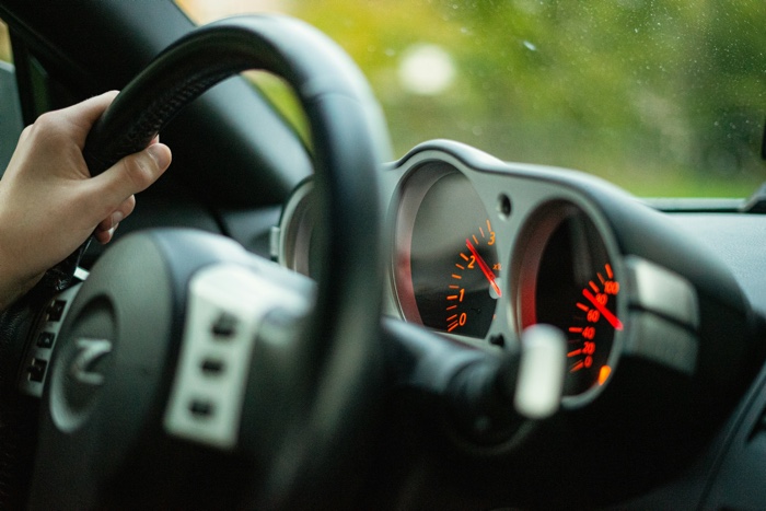 rob-scholten-steering wheel-unsplash - Ottawa Road Trips closeup of a hand on a steering wheel