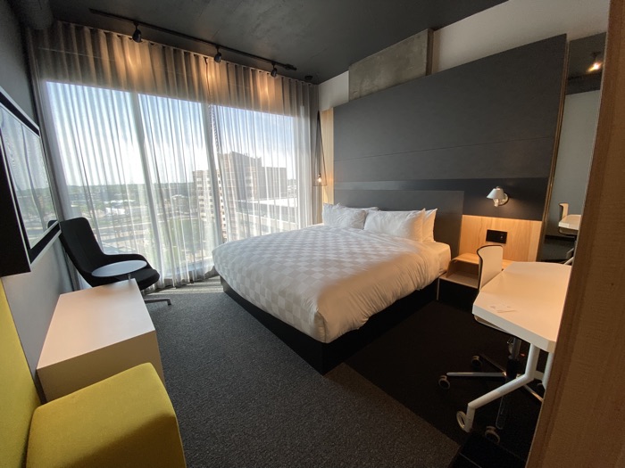 alt saskatoon - Ottawa Road Trips hotel room with floor to ceiling windows, bed and desk