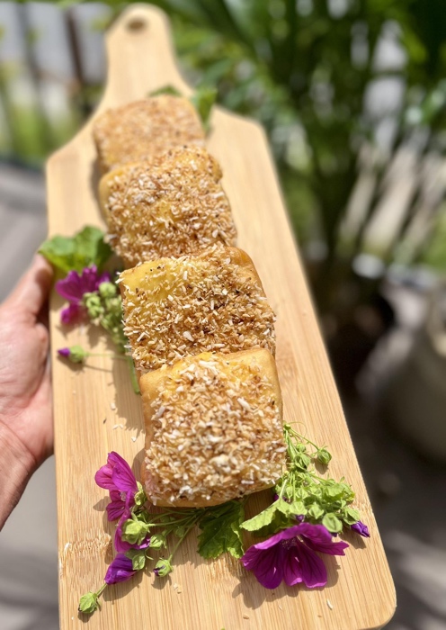 board of pastries decorated with flowers