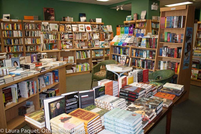 small bookstore with shelves and tables of books