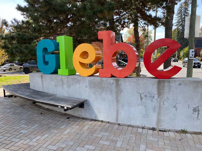 large multicoloured street sculpture reading glebe
