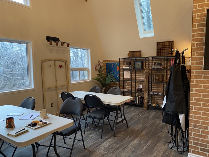 stone manor studios newboro - Ottawa Road Trips art studio with tables and chairs, large windows, brick walls, wood floor