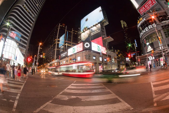 yonge and dundas destination toronto - Ottawa Road Trips busy street corner at yonge and dundas in toronto with illuminated buildings and streetcar.