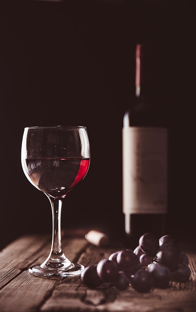 angelovillalobos44-wine chocolate pixabay 640 - Ottawa Road Trips glass of red wine next to some chocolate bon bons, with wine bottle in background