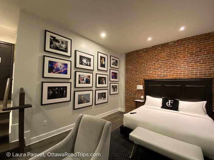 backstage room frontenac club - Ottawa Road Trips hotel room with framed photos of rock musicians and exposed brick wall