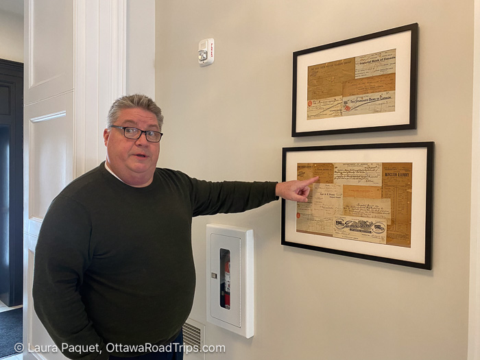 sean billing frontenac club - Ottawa Road Trips man pointing to a frame containing multiple yellowed receipts