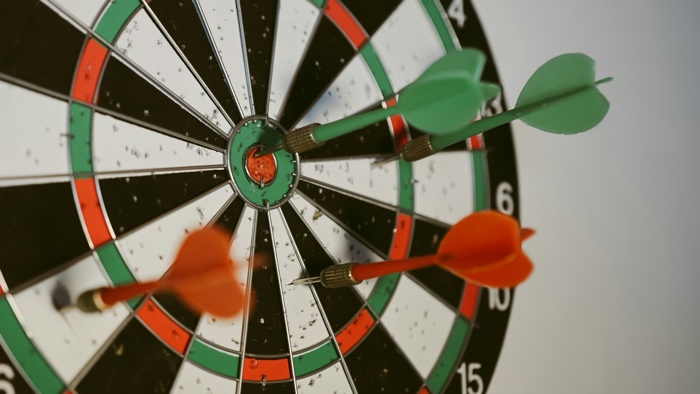 afif-ramdhasuma-darts-unsplash - Ottawa Road Trips closeup of red and green darts sticking out of a dartboard