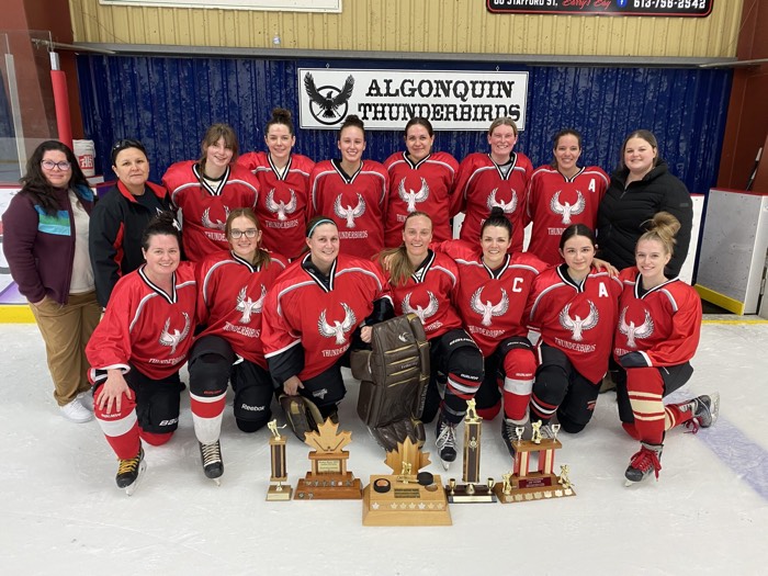 algonquin thunderbirds women's hockey tea posing with their 2024 trophies