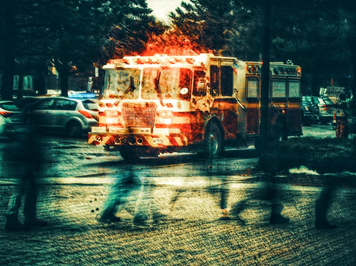 long exposure photograph of a fire truck on a city street