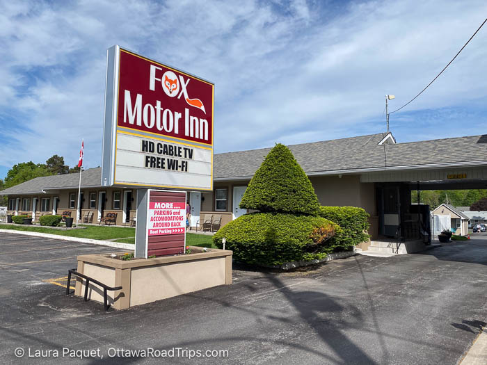 single-story building with large sign out front reading fox motor inn