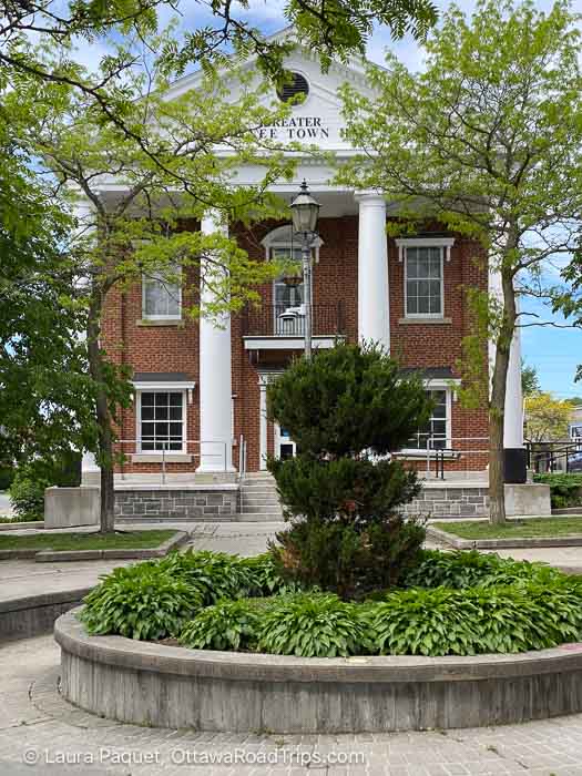 greater napanee town hall, a classical-style red brick building with white pillars.