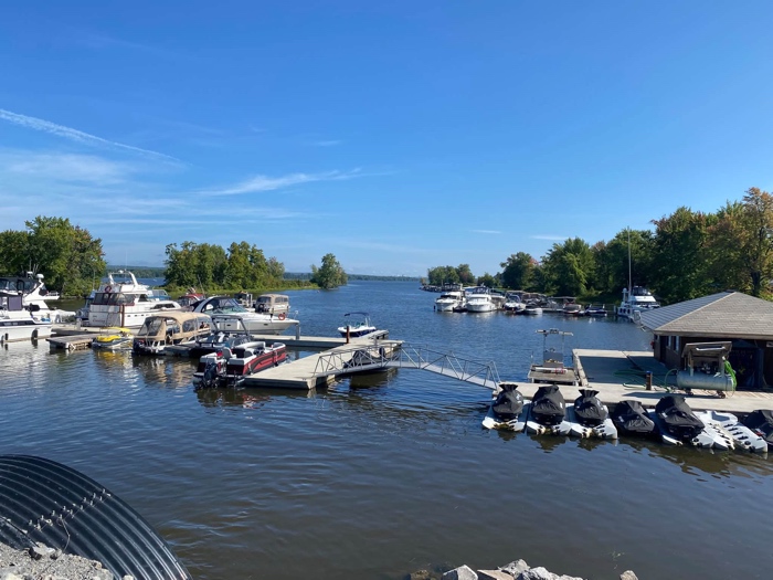 small pleasure boats moored on floating docks