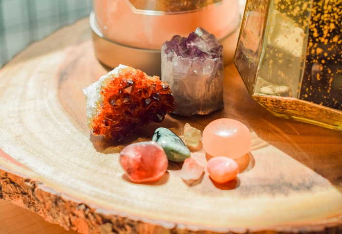 sarah-brown-crystals-unsplash - Ottawa Road Trips a variety of raw and polished crystals on a natural wood table