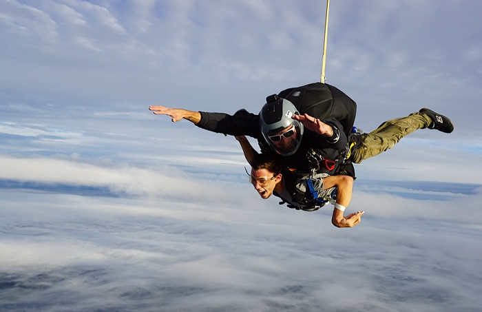 freefall smile x1 airborne petawawa lr - Ottawa Road Trips tandem skydivers smiling against background of blue skies and clouds